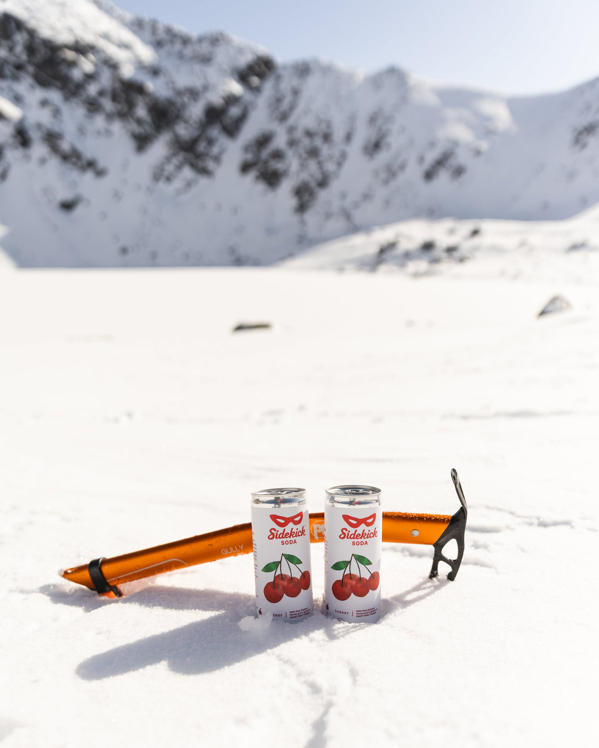 Sidekick Cherry cans in alpine snow