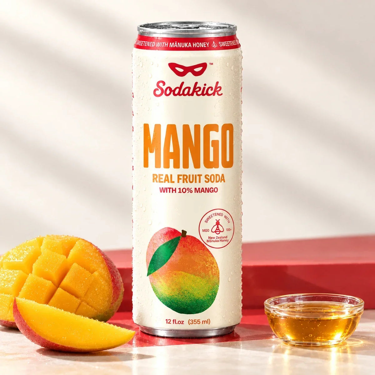 Sidekick Mango honey soda can with mango and a bowl of honey