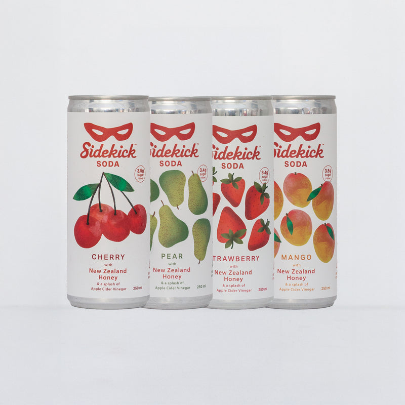 Four Sidekick Soda cans side by side: Cherry, Pear, Strawberry, and Mango