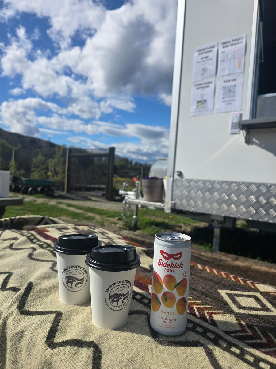 Sidekick cans at a mobile coffee trailer on the road